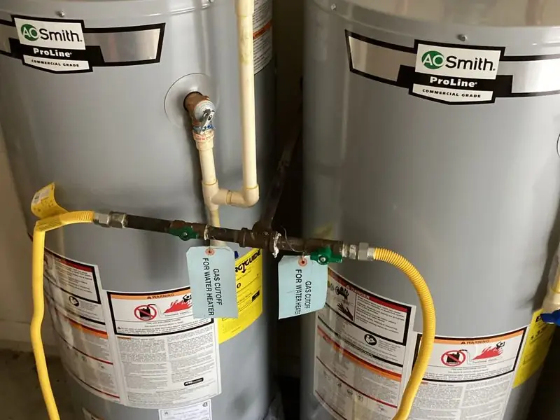 Head's Plumbing install of two A. O. Smith commercial-grade gas water heaters.